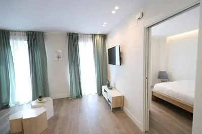 Cama o camas de una habitación en San Vicente Apartments