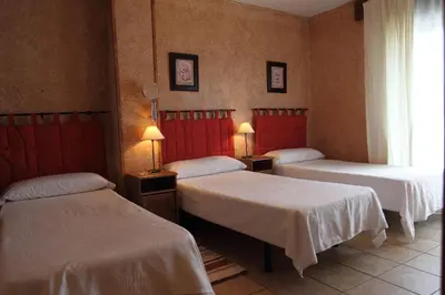 Cama o camas de una habitación en El Mirador del Alberche III