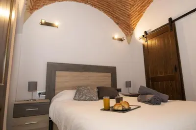 Cama o camas de una habitación en Elegante Apartamento para 5 en el centro de Cáceres con wifi