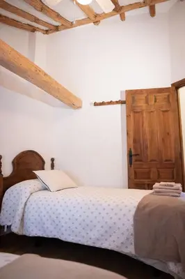 Cama o camas de una habitación en Casa Rural los Enebros