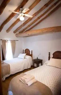 Cama o camas de una habitación en Casa Rural los Enebros