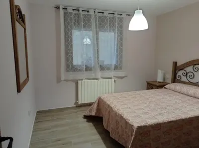 Cama o camas de una habitación en Alojamientos Rurales Hurdes Altas - La Antigua Guarderia