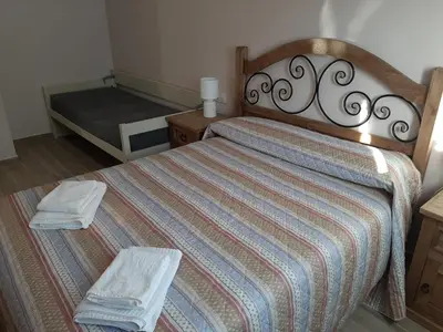 Cama o camas de una habitación en Alojamientos Rurales Hurdes Altas - La Antigua Guarderia
