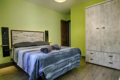 Cama o camas de una habitación en La Casa de Nini