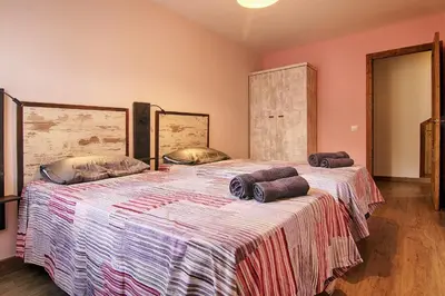 Cama o camas de una habitación en La Casa de Nini