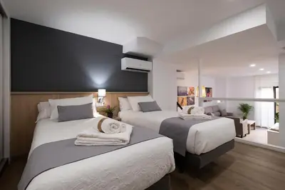 Cama o camas de una habitación en Luxor Torre del Clavero Apartments