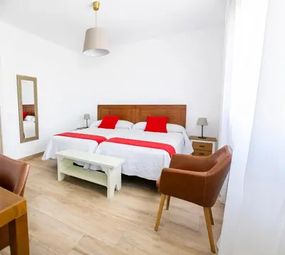 Cama o camas de una habitación en Apartamentos rurales Posada de Monfragüe con jacuzzi