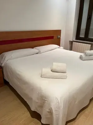 Cama o camas de una habitación en ARTHEUS APARTAMENTOS
