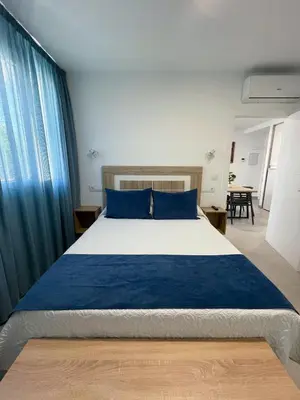 Cama o camas de una habitación en Apartamentos Lusitania Parking Gratis bajo disponibilidad