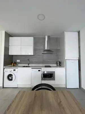 Una cocina o zona de cocina en Apartamentos Lusitania Parking Gratis bajo disponibilidad