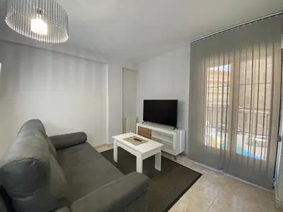 Una televisión o centro de entretenimiento en Apartamento Serranos Centro Histórico