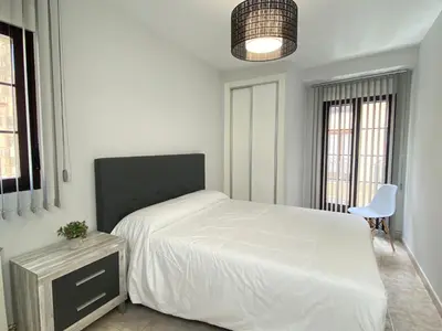 Una televisión o centro de entretenimiento en Apartamento Serranos Centro Histórico