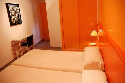 Cama o camas de una habitación en Hostal El Cardenillo