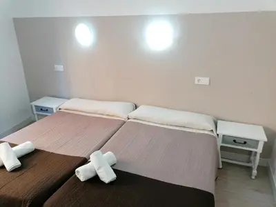 Cama o camas de una habitación en Hostal Hernan Cortes