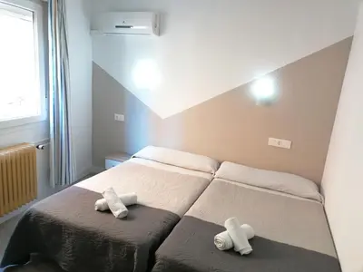Cama o camas de una habitación en Hostal Hernan Cortes
