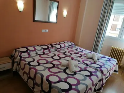 Cama o camas de una habitación en Hostal Hernan Cortes