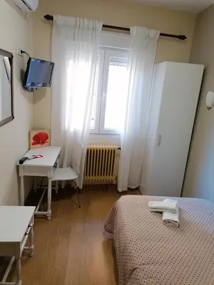 Cama o camas de una habitación en Hostal Hernan Cortes