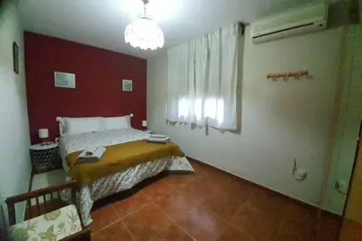 Cama o camas de una habitación en CASA RURAL LAS TRAVIESAS 2