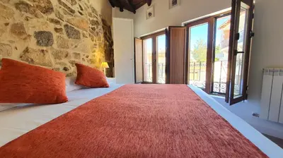 Cama o camas de una habitación en Casas del Castillo, 3