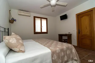 Cama o camas de una habitación en Casa Rural La Molinera Riolobos Caceres