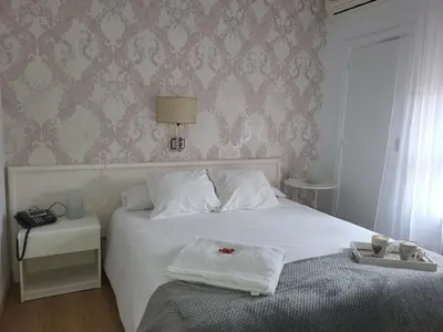 Cama o camas de una habitación en HOTEL LOS ARENALES DE JERTE