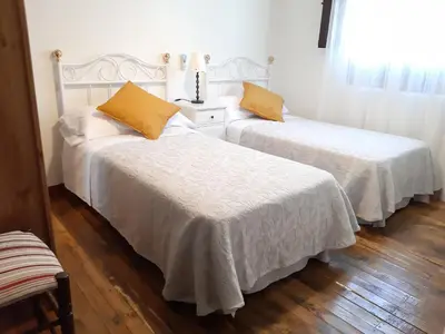 Cama o camas de una habitación en La Serrana de la Vera Casa Rural TR-CC-00366