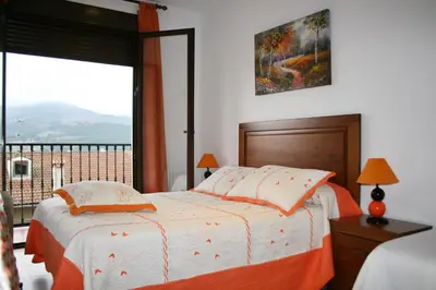 Cama o camas de una habitación en Apartamentos Turisticos Mirayuste