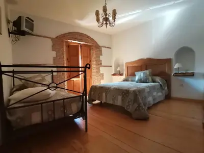 Cama o camas de una habitación en La Aldaba del siglo XX