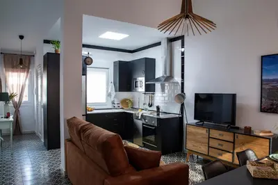 Una televisión o centro de entretenimiento en Apartamentos Rurales Helechosa, Las Tres Peñas