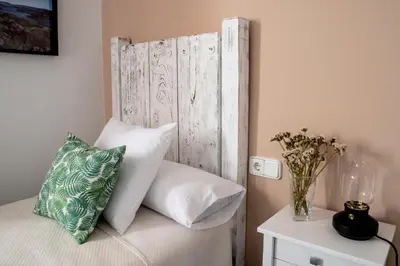 Cama o camas de una habitación en Apartamentos Rurales Helechosa, Las Tres Peñas