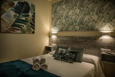 Cama o camas de una habitación en EL ENCANTO DEL ALBERCHE