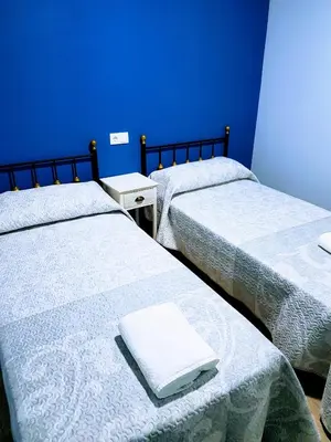 Cama o camas de una habitación en APARTAMENTOS LOS ÁLAMOS