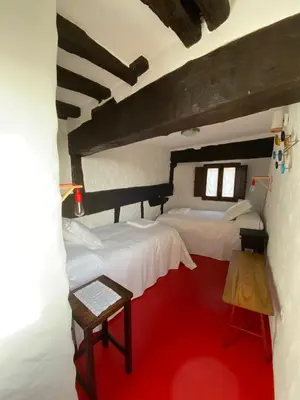 Cama o camas de una habitación en Lanzaroco, tu casa en La Vera