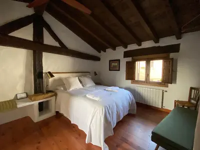 Cama o camas de una habitación en Lanzaroco, tu casa en La Vera