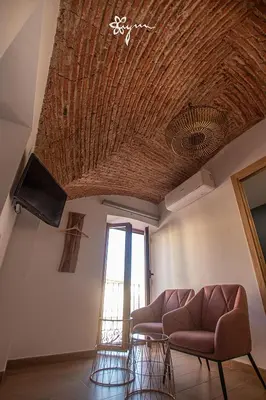 Una televisión o centro de entretenimiento en Apartamentos Turísticos AbrilyMarzo