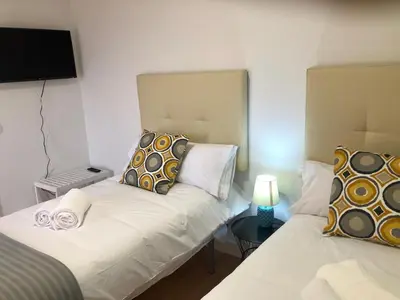Cama o camas de una habitación en EL MIRADOR DE CACERES