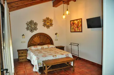 Cama o camas de una habitación en El Hojaranzo. Casa rural con encanto en Candeleda