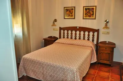 Cama o camas de una habitación en El Hojaranzo. Casa rural con encanto en Candeleda