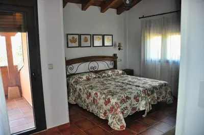 Cama o camas de una habitación en El Hojaranzo. Casa rural con encanto en Candeleda