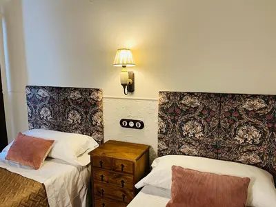 Cama o camas de una habitación en La Cuestecilla