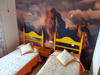 Cama o camas de una habitación en Hostal Avenida