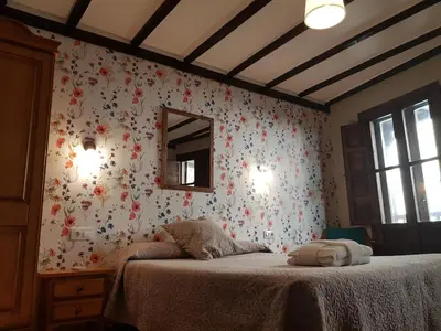 Cama o camas de una habitación en Hotel Judería Valle del Jerte