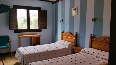 Cama o camas de una habitación en Hotel Judería Valle del Jerte
