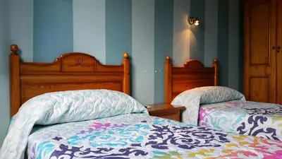 Cama o camas de una habitación en Hotel Judería Valle del Jerte