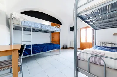 Cama o camas de una habitación en Albergue las Veletas