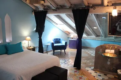 Cama o camas de una habitación en Hotel la Boheme