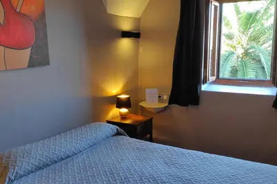 Cama o camas de una habitación en Hotel la Boheme