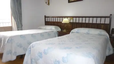 Cama o camas de una habitación en Hostal Cerezo