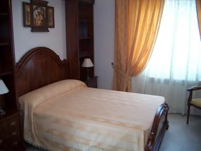 Cama o camas de una habitación en Hostal Cerezo
