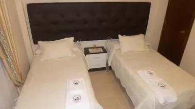 Cama o camas de una habitación en Hostal Cerezo
